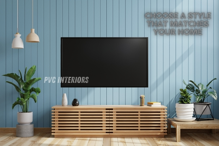 Elegant PVC TV unit with wooden slatted cabinet against light blue wall, complemented by modern indoor plants, designed by PVC Interiors