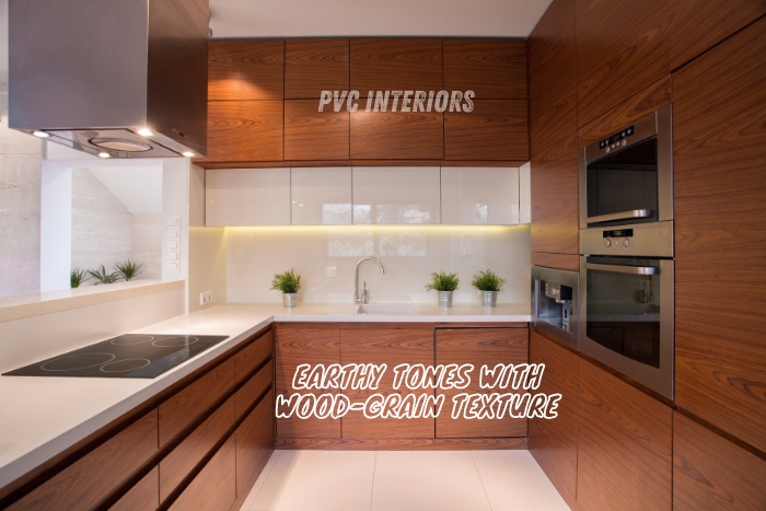 Modern PVC modular kitchen with earthy tones and realistic wood-grain texture, perfect for contemporary interiors by PVC Interiors