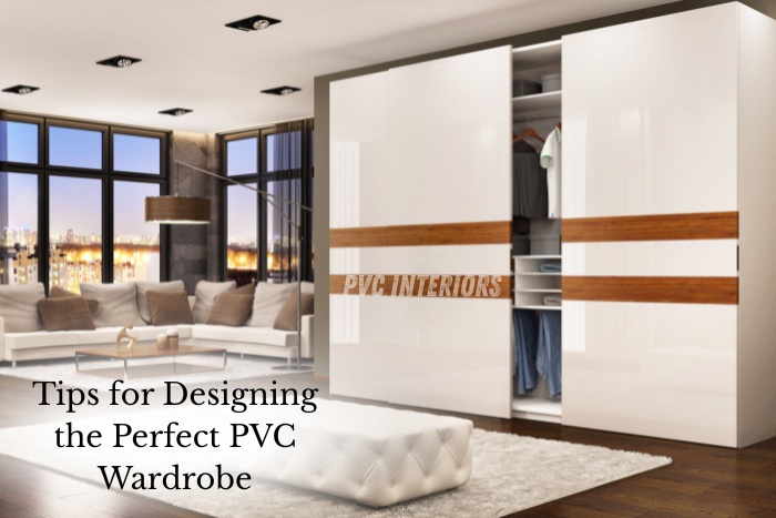 Modern sliding PVC wardrobe with glossy white finish and wooden accents by PVC Interiors in Bengaluru