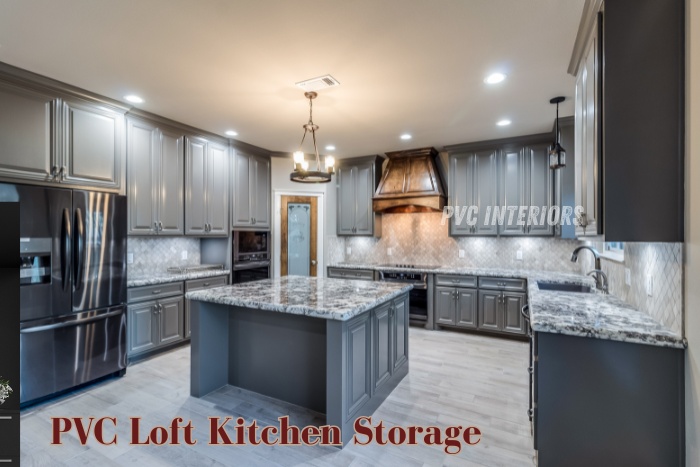 Spacious PVC loft kitchen storage with elegant grey cabinets and marble countertop by PVC Interiors in Bengaluru